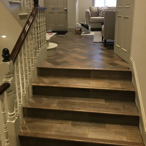 Decorated hallway and staircase in a London home by A1 Decorating